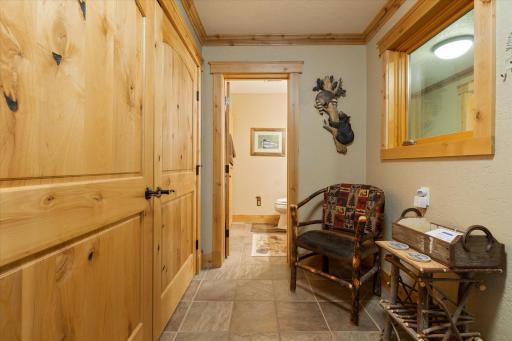 mud room with oversized closets and 3/4 bathroom