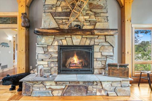 custom fireplace stone and hearth installed piece by piece by a local stone mason