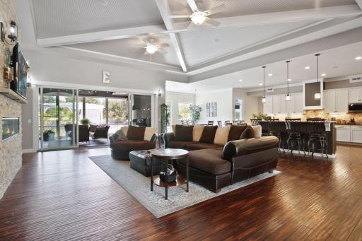 Family friendly great room walkouts out to the screened in porch.