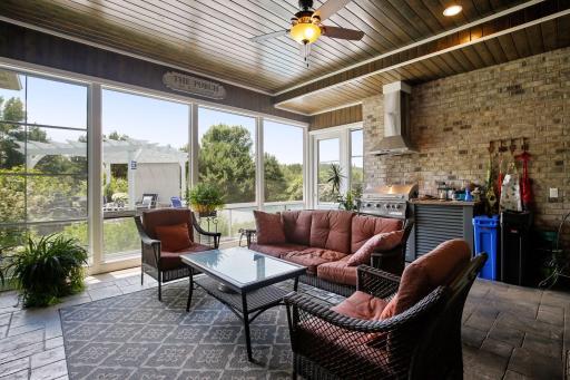 Screened in porch looks out over the pool & private backyard.