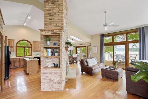 This home is truly made for both entertaining and everyday living, with plenty of space and fabulous views. Enjoy an open floor plan, high ceilings and a classic floor-ceiling brick 3-sided gas fireplace !!