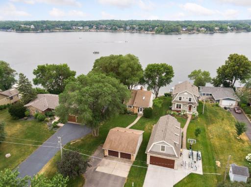 Sweeping aerial drone images of the homeâs acreage, lake and charming tight knit neighborhood. Conveniently located to a peaceful park, boat launch and local attractions !!