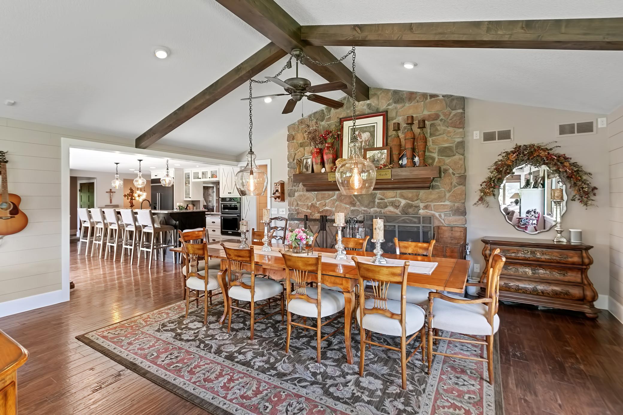 Wood burning fireplace with brick accent.