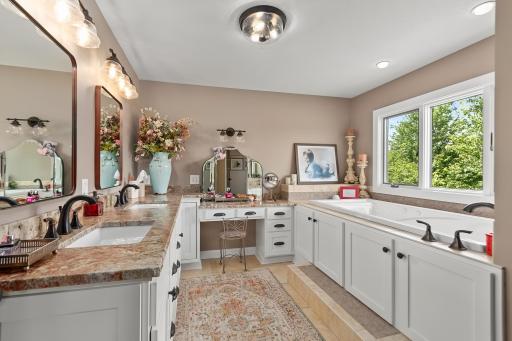 Updated owners bath with dual sinks, soaking tub and separate shower.