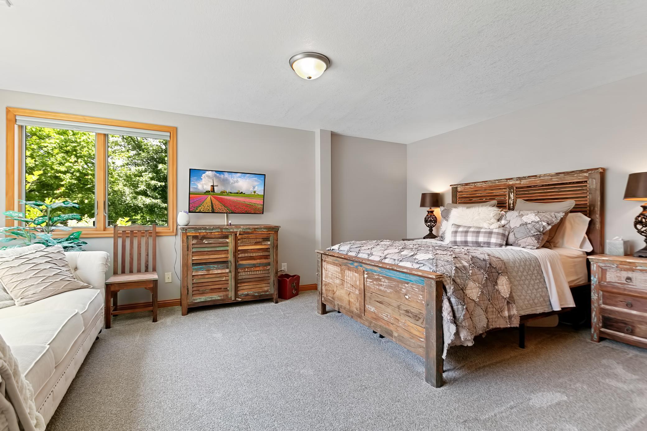 One of the three bedrooms located in the lower level. Bright room with large windows.