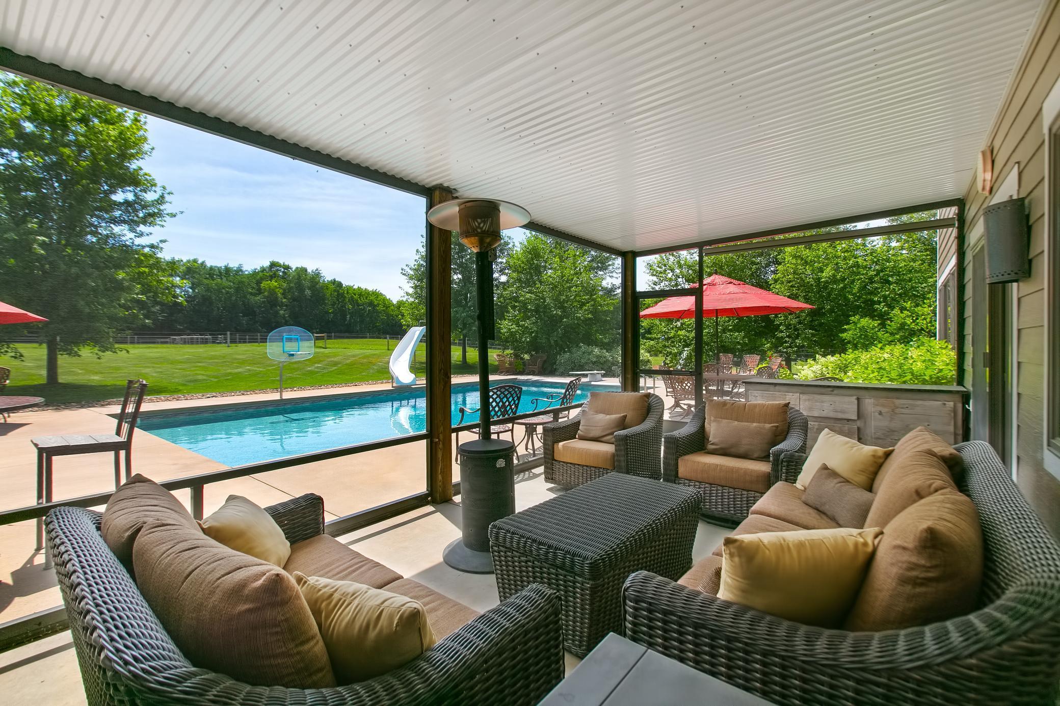 Beautiful screened in porch with lots seating available.