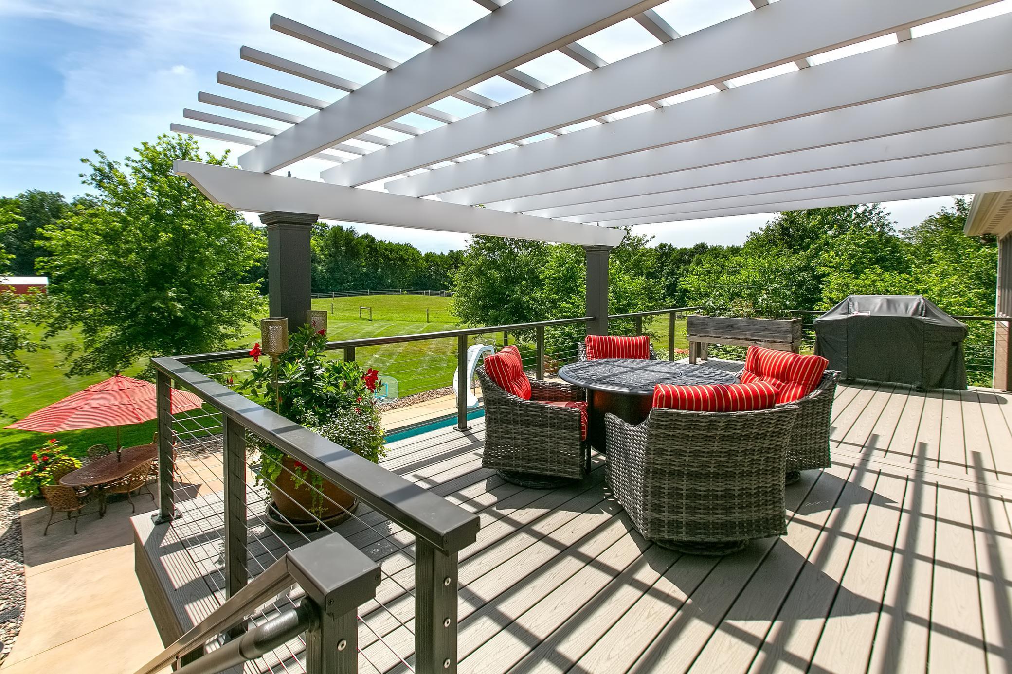 Fabulous deck just off the kitchen and overlooking the pool.