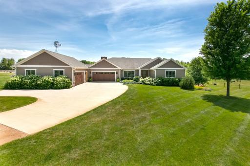 Sprawling rambler built in 2007 with a heated oversized four car garage with office space as well.