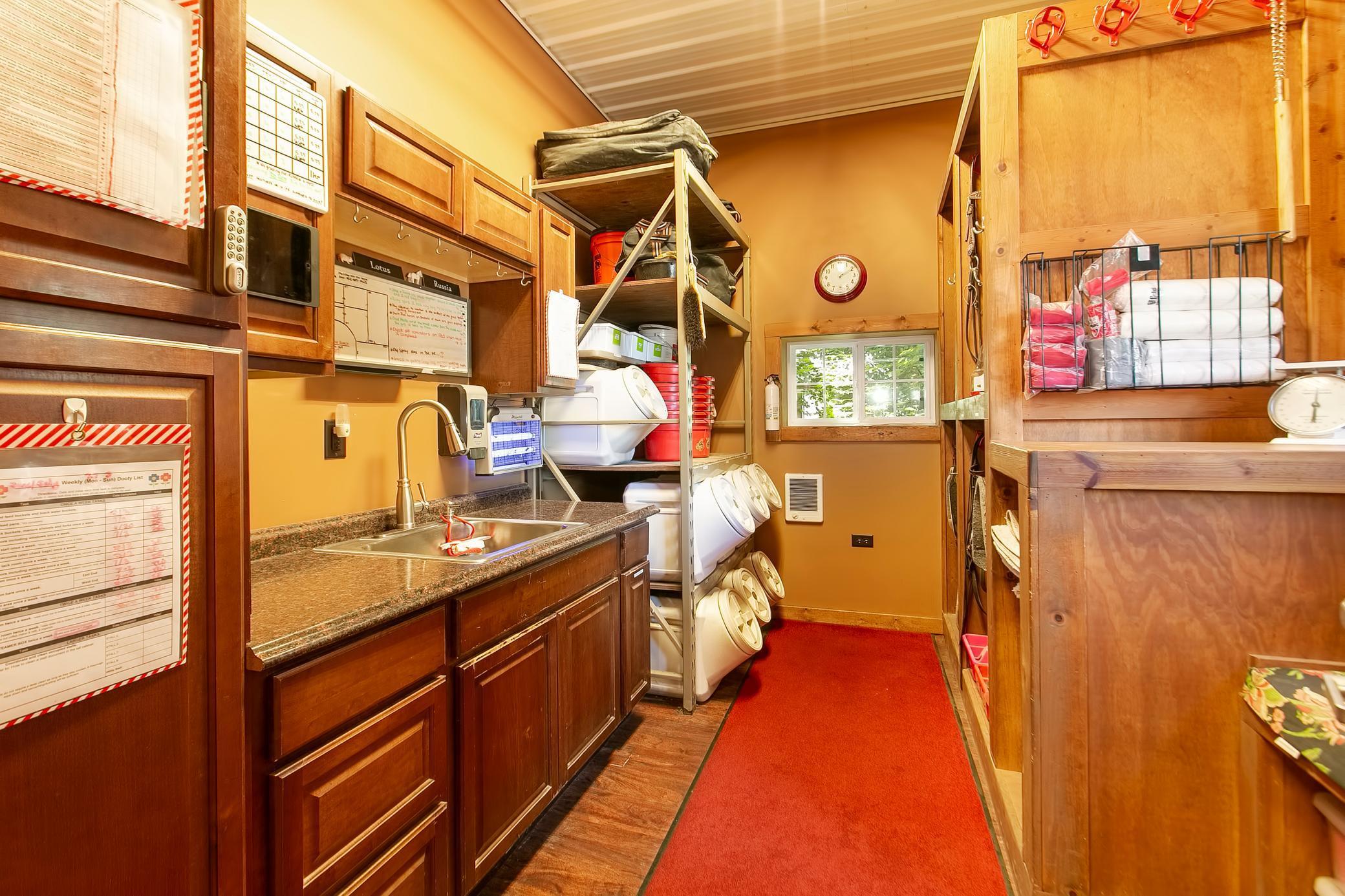 The barn and shop both have in depth security systems, including this secured feed room.