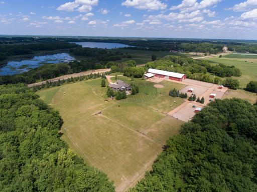 Lovely arial featuring the pastures surrounded by woods.