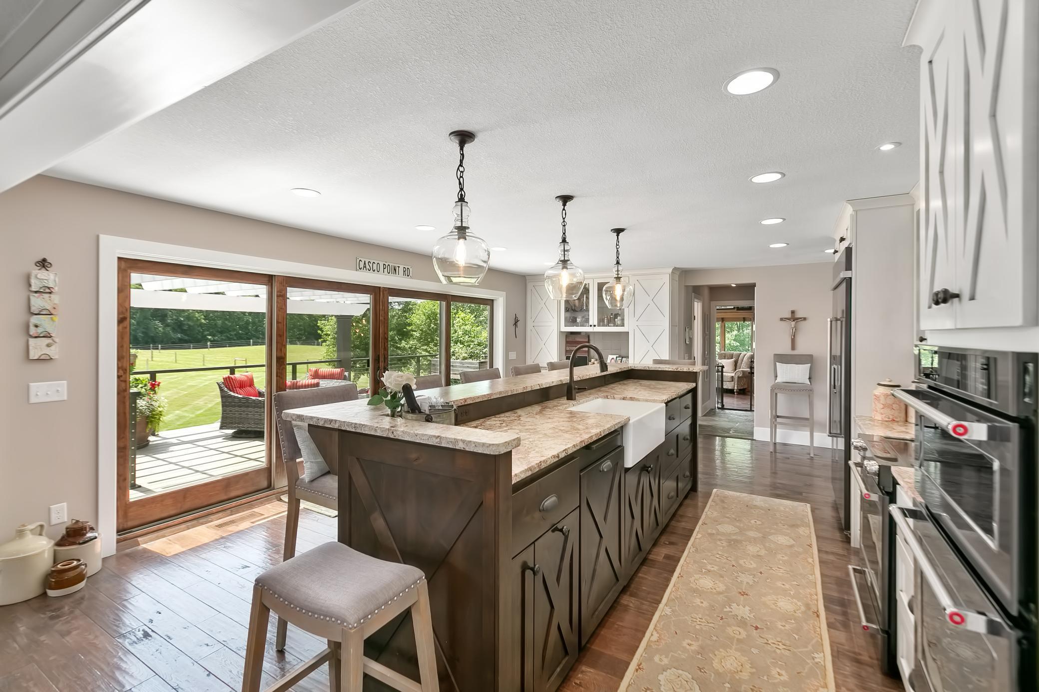 Chef's kitchen featuring double ovens.