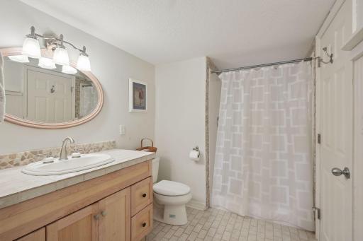 The lower level 3/4 bathroom offers 2 entrances for convenience.