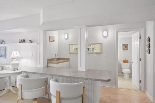 An ideal space to refresh your beverage. The wet bar is ready for your entertaining needs. This area also gives access to the 3/4 bathroom.