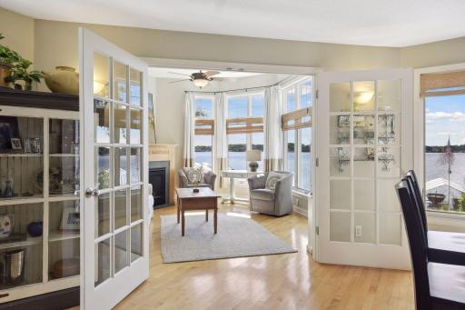 Across from the kitchen you'll be drawn into a peaceful sunroom offering an abundance of natural light and beautiful lake views.
