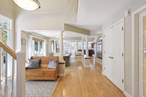 The open main floor layout offers maple floors, large windows for natural daylight and neutral colors.