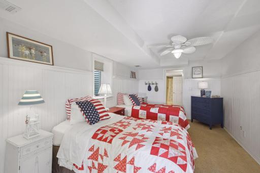 The 4th bedroom is located on the lower level and designed with the nautical vibe. This room has direct access to the 3/4 bathroom.