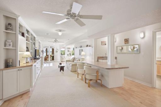 Upon entering the lower level you'll notice the wet bar, family room, sitting area with lake views just beyond.