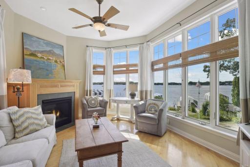 A room you won't want to leave. The wall of windows brings the bay front and center, 2nd of 4 fireplaces and ceiling fan all enhance this relaxing space.