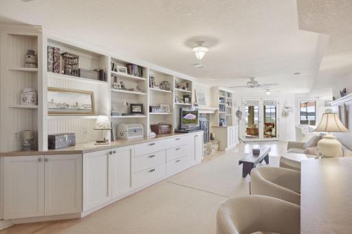 Custom built-ins with bead board accent and nautical light fixtures give this home the lake feel. The 4th gas burning fireplace makes this a cozy spot on a chilly night.