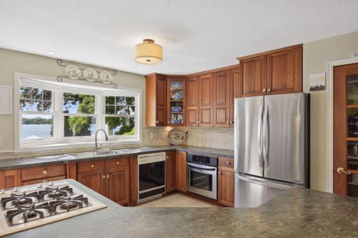 If more storage is needed this kitchen offers a pantry and center island cabinets, both front and back access, to house additional dish ware or larger cooking essentials.