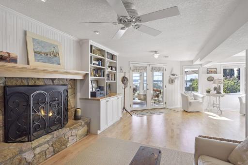Just beyond the family room is a sitting area flooding with natural light, access to the 4th bedroom and entrance to the screened in porch.