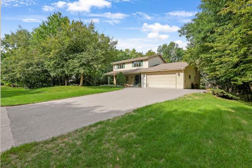 Welcome Home! This stately 2-story, 5 bedroom home prominently sits on a 1/2 acre wooded lot.