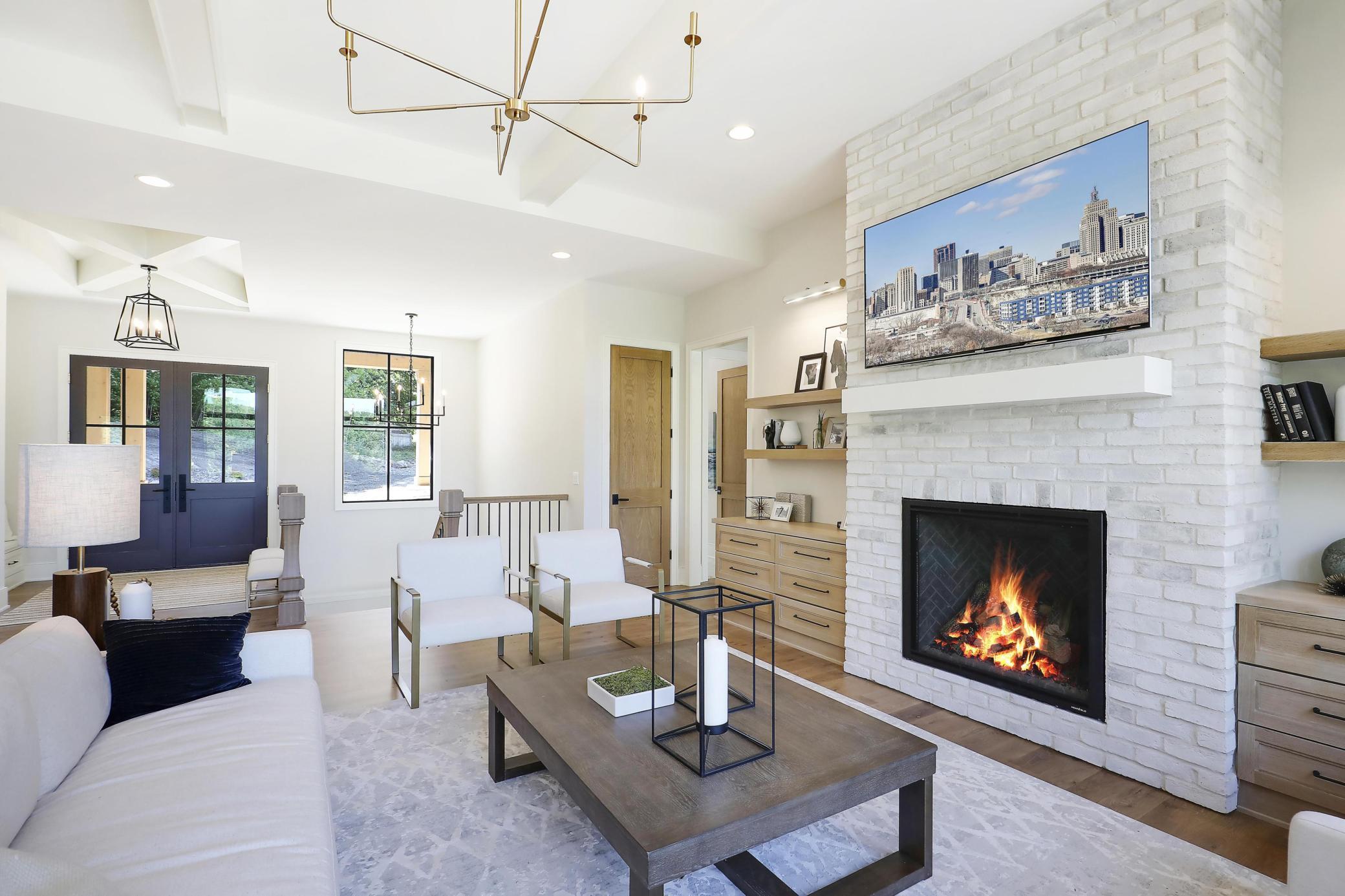 Stunning Floor To Ceiling Gas Fireplace With White Painted Brick