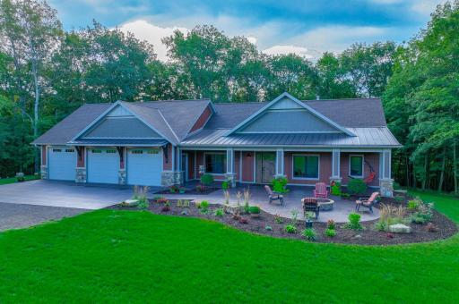 Custom home sits on an 8+ acre slice of heaven w/splendid landscaping.