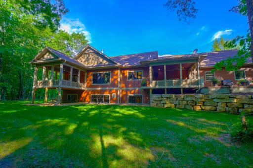 The backyard is an entertainer's dream with private wooded views, a covered and uncovered porch (wired with surround sound), and hot tub powerpoint.