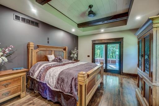 Down the hall, the master bedroom features a large private porch, a walk-in closet with built-in soft-close dressers, and a 3/4 bathroom with 2 shower heads.