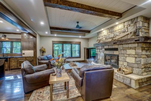 The main level family room wired with surround sound also features a wood-burning fireplace.