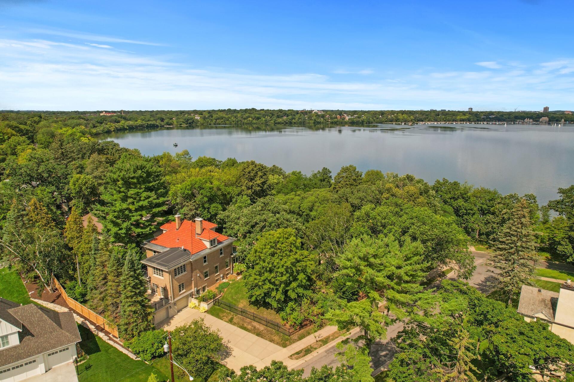 Excellent location on a spacious corner lot with fully fenced yard, stately columns and gated entrance, enormous deck, whimsical grotto soaking pool with waterfall feature and expansive stone terrace, plus mature trees for added privacy.