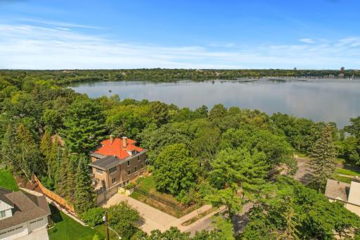 Excellent location on a spacious corner lot with fully fenced yard, stately columns and gated entrance, enormous deck, whimsical grotto soaking pool with waterfall feature and expansive stone terrace, plus mature trees for added privacy.