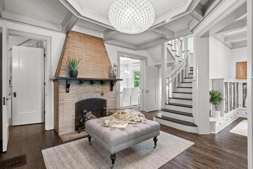 Step into the foyer and you will be in awe of all the beauty this home offers - cozy wood-burning fireplace, exquisite lighting, and gorgeous refinished hardwood floors.