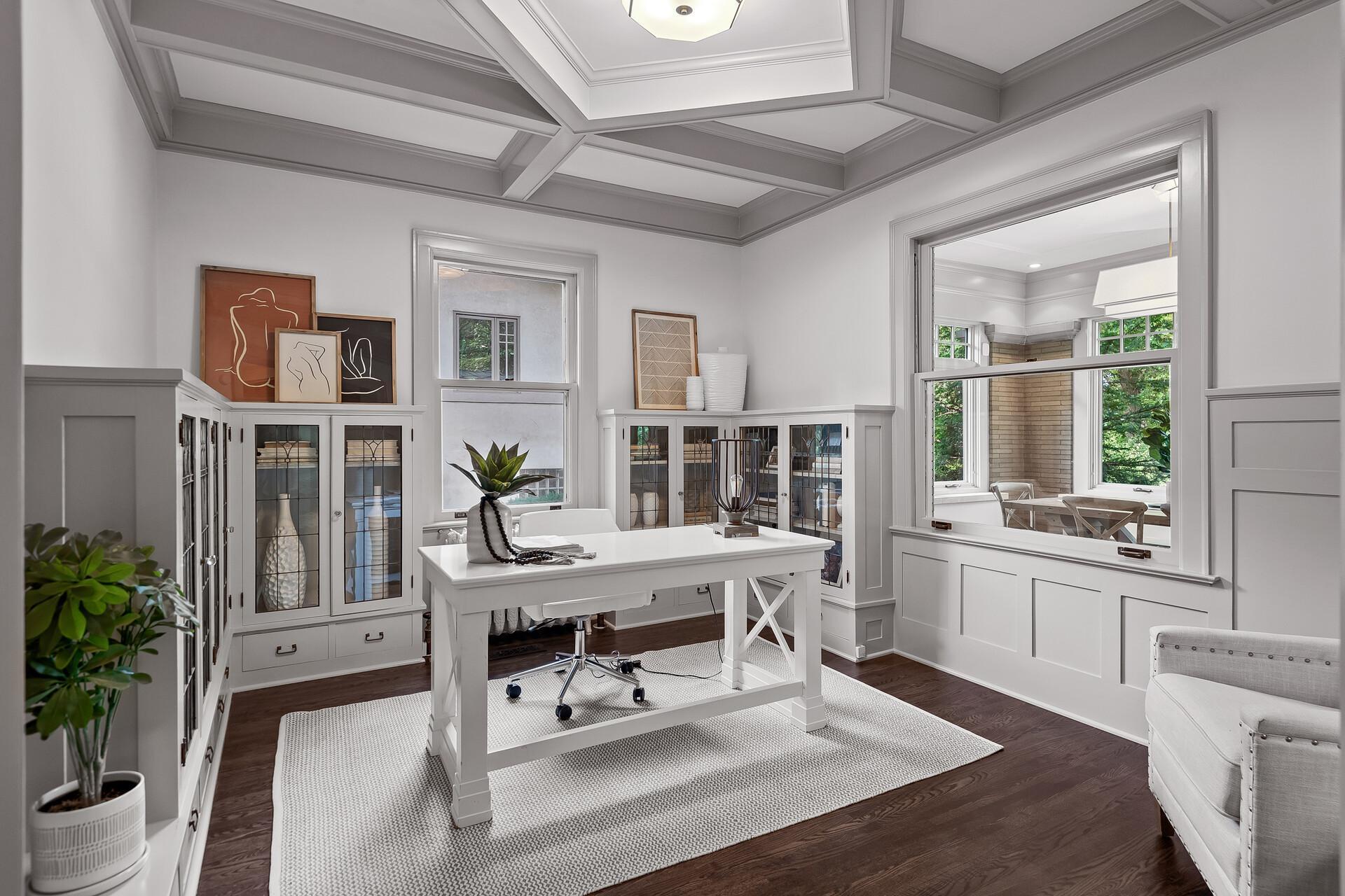 Main level office with beautiful built-ins. Also on the main level is an adorable sunken powder room.