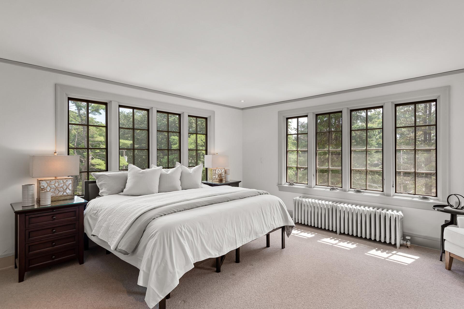 Expansive upper level has an excellent layout and hardwood floors throughout much of it. Owner’s Suite with private balcony and private bath, walk-in closet with custom built-ins and 2nd level laundry.