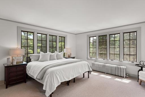 Expansive upper level has an excellent layout and hardwood floors throughout much of it. Owner’s Suite with private balcony and private bath, walk-in closet with custom built-ins and 2nd level laundry.