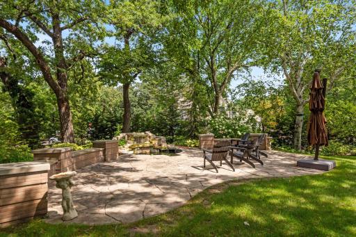 Huge patio is the perfect spot to lounge and enjoy the outdoors next to the peaceful pool.