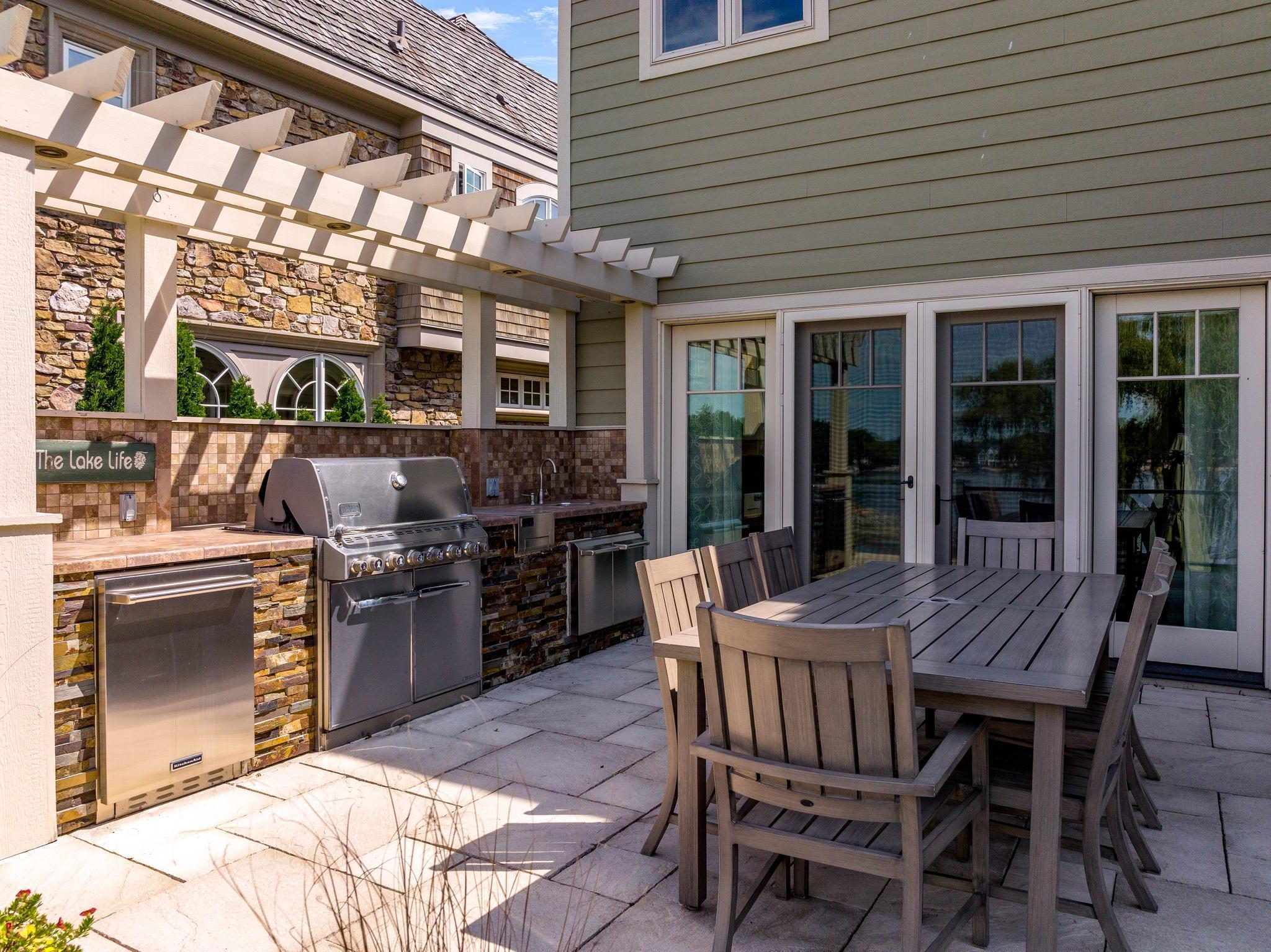 Large Deck with built-in grilling station completely extends the living and entertaining space