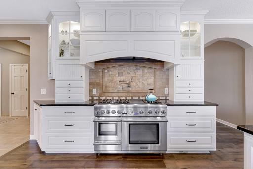 Professional grade appliances include a dual fuel 48” Thermador range w/ cabinet paneled vent, cabinet paneled refrigerator, cabinet paneled Jenn-Air dual refrigerator and freezer drawers built-in microwave and dishwasher