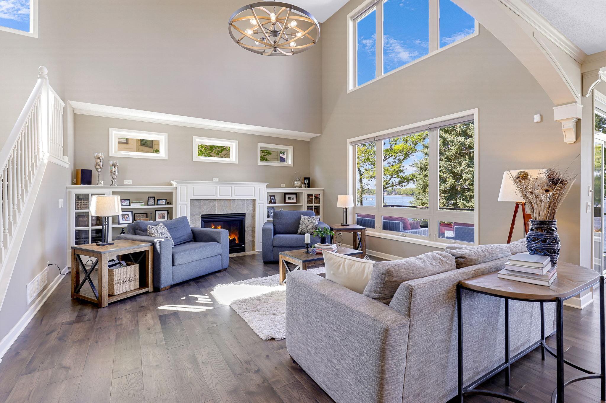 Floor to ceiling windows capture incredible views of Lower Prior Lake