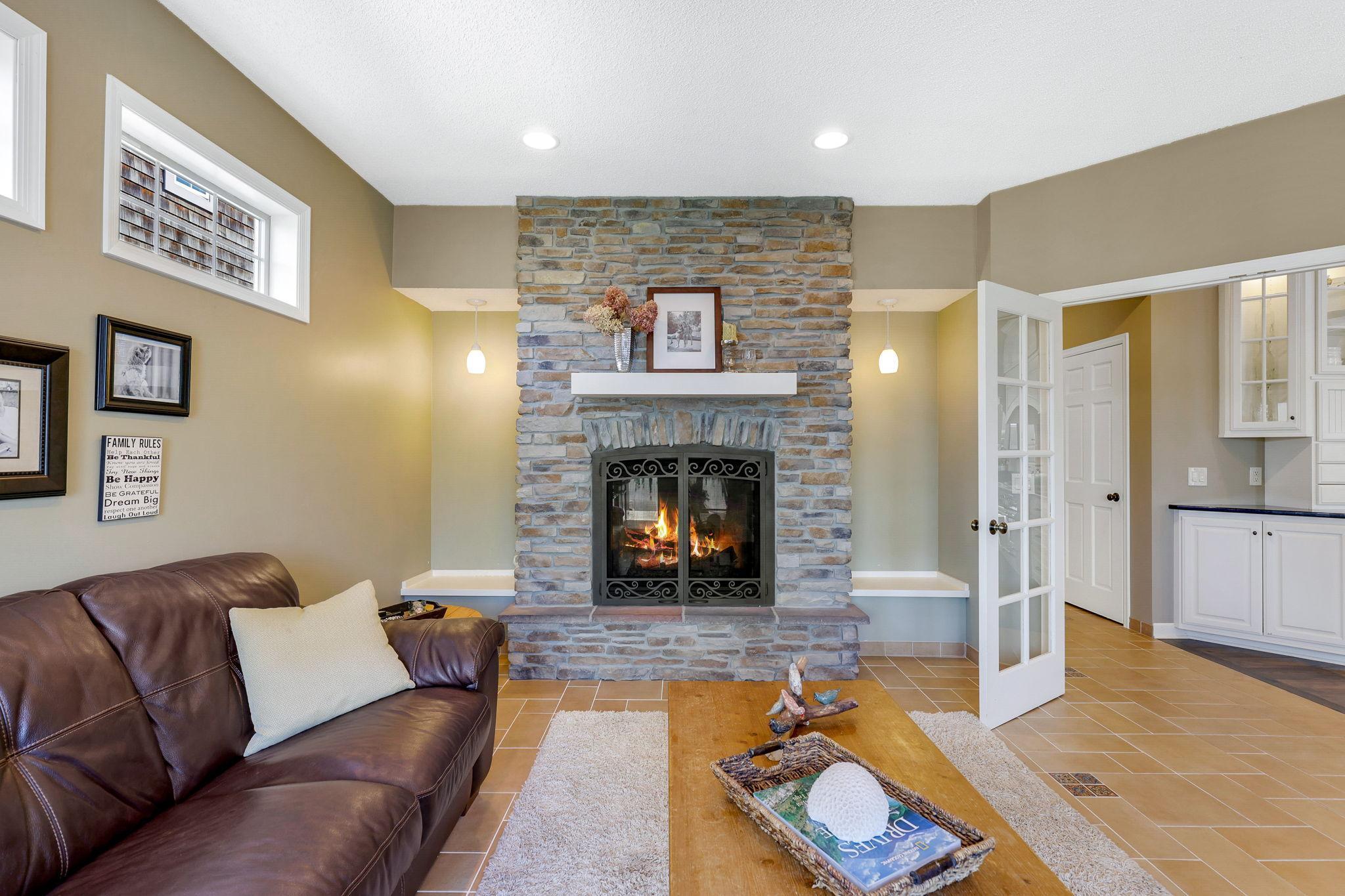 Full glass French doors on into the main level Den. Enjoy the gas firepalce with cultured stone surround and raised hearth