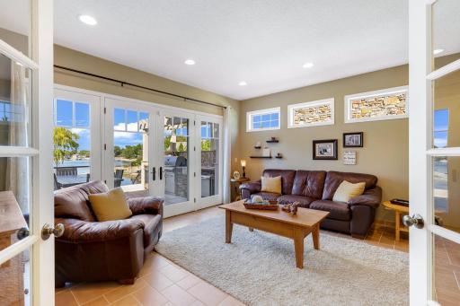 Den offers fantastic lake views and access to the large deck and property