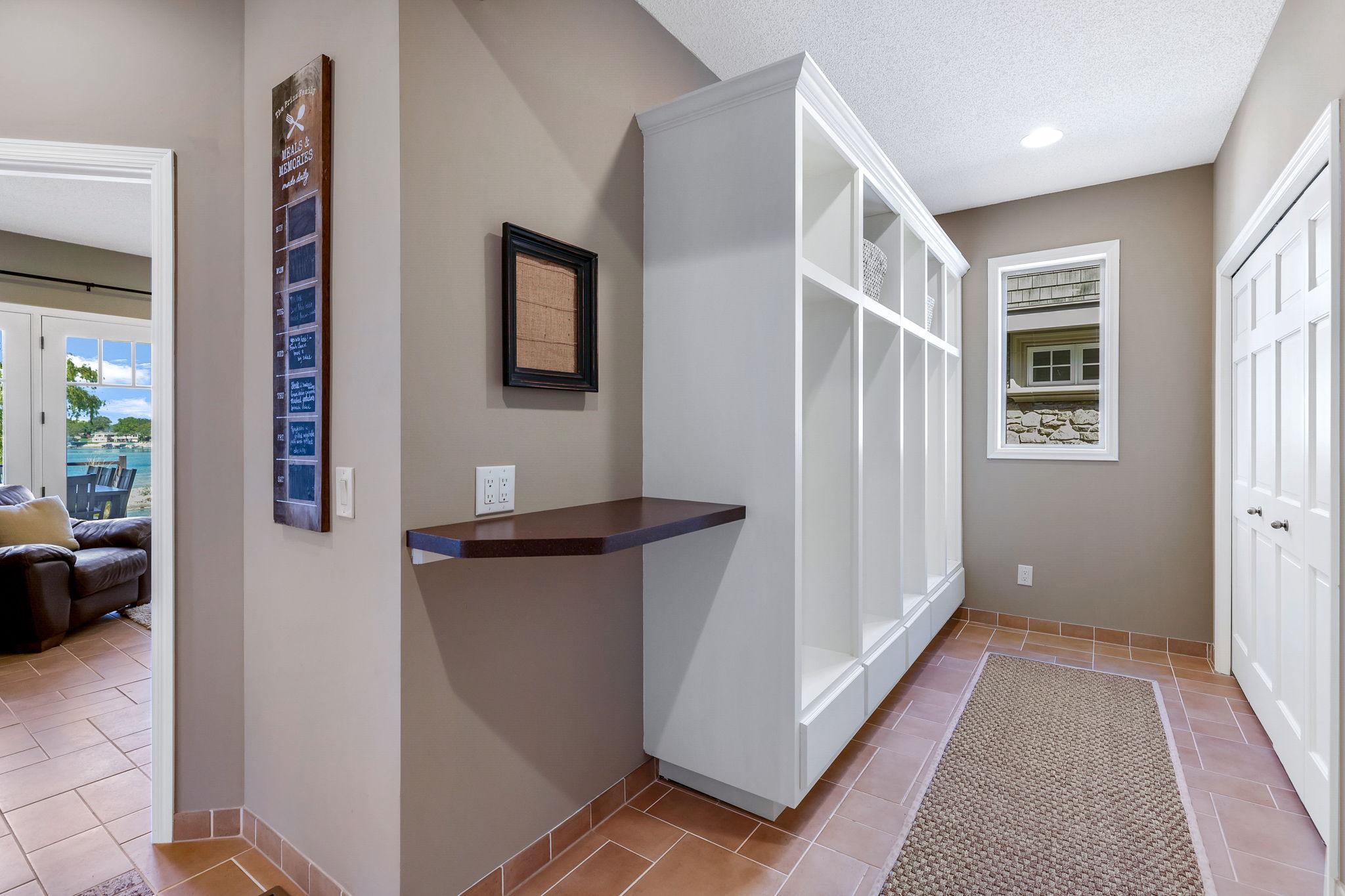 Mudroom offers lockers and additional closet storage