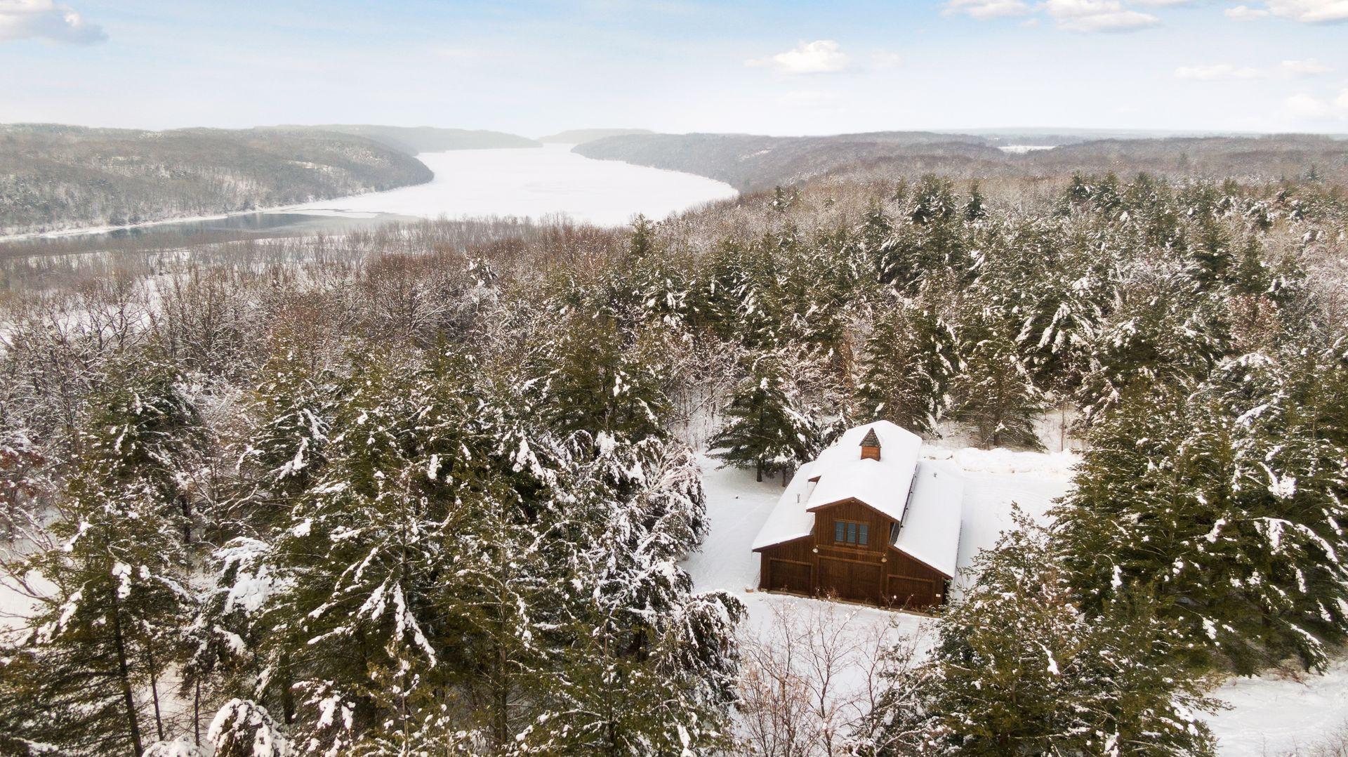 This stick built barn was recently outfitted with a climate controlled gym in the upper level, and finished the main level with epoxy floors-great for storing all the toys!