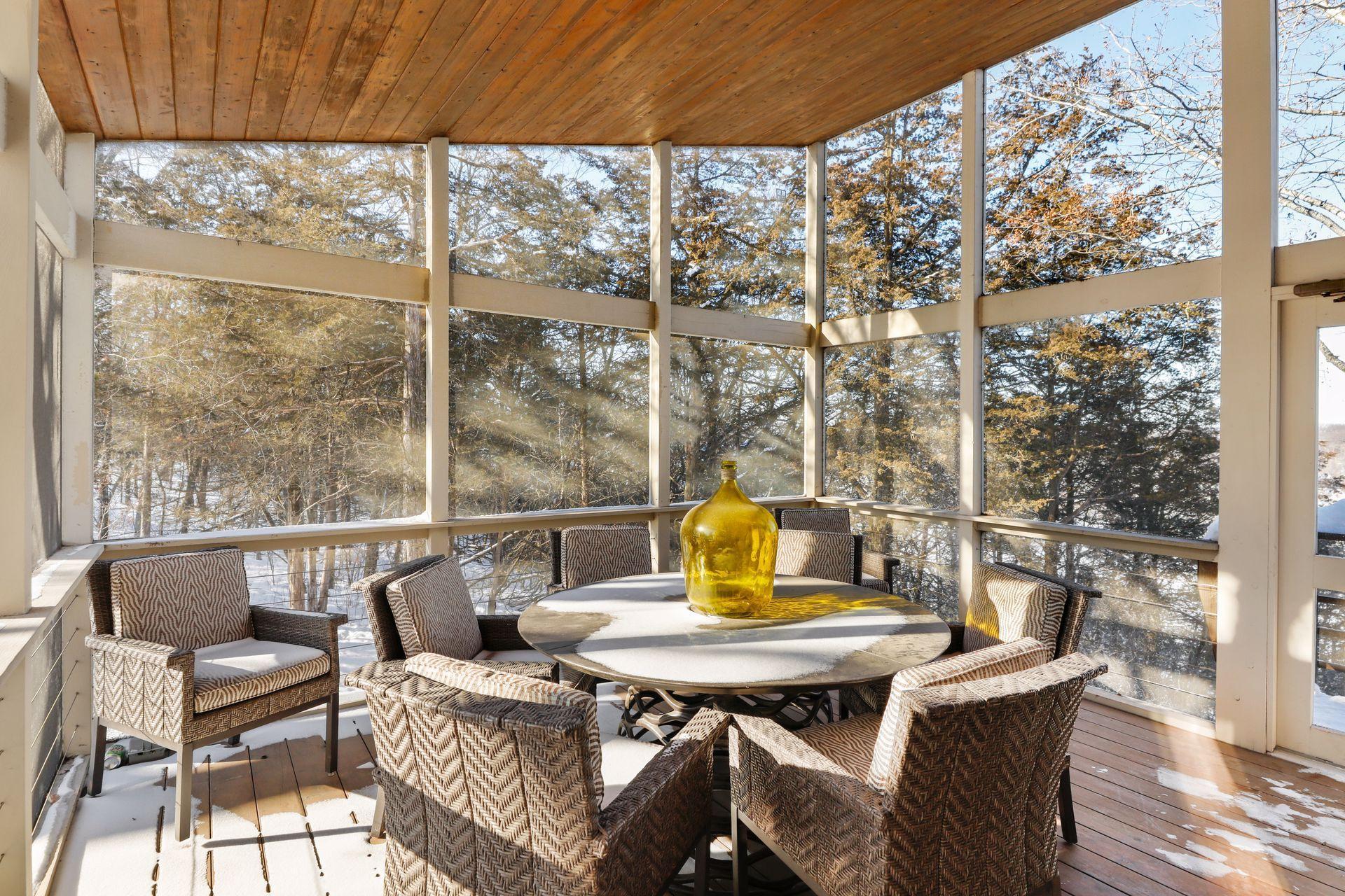 The screened porch riverside is an essential room for those summer evenings. Or lounge with a good book, or take a nap on a lazy afternoon. Easy access off of the kitchen/great room space.