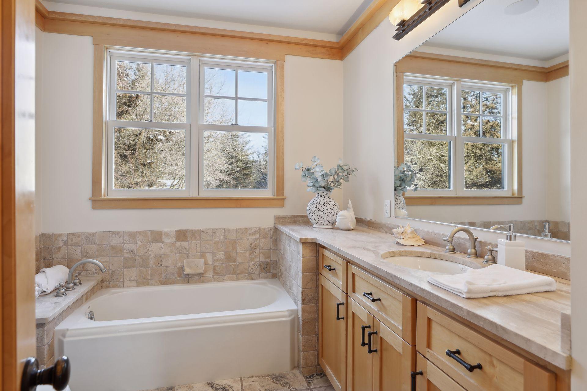 The second main level full bathroom with separate tub and shower for guests.