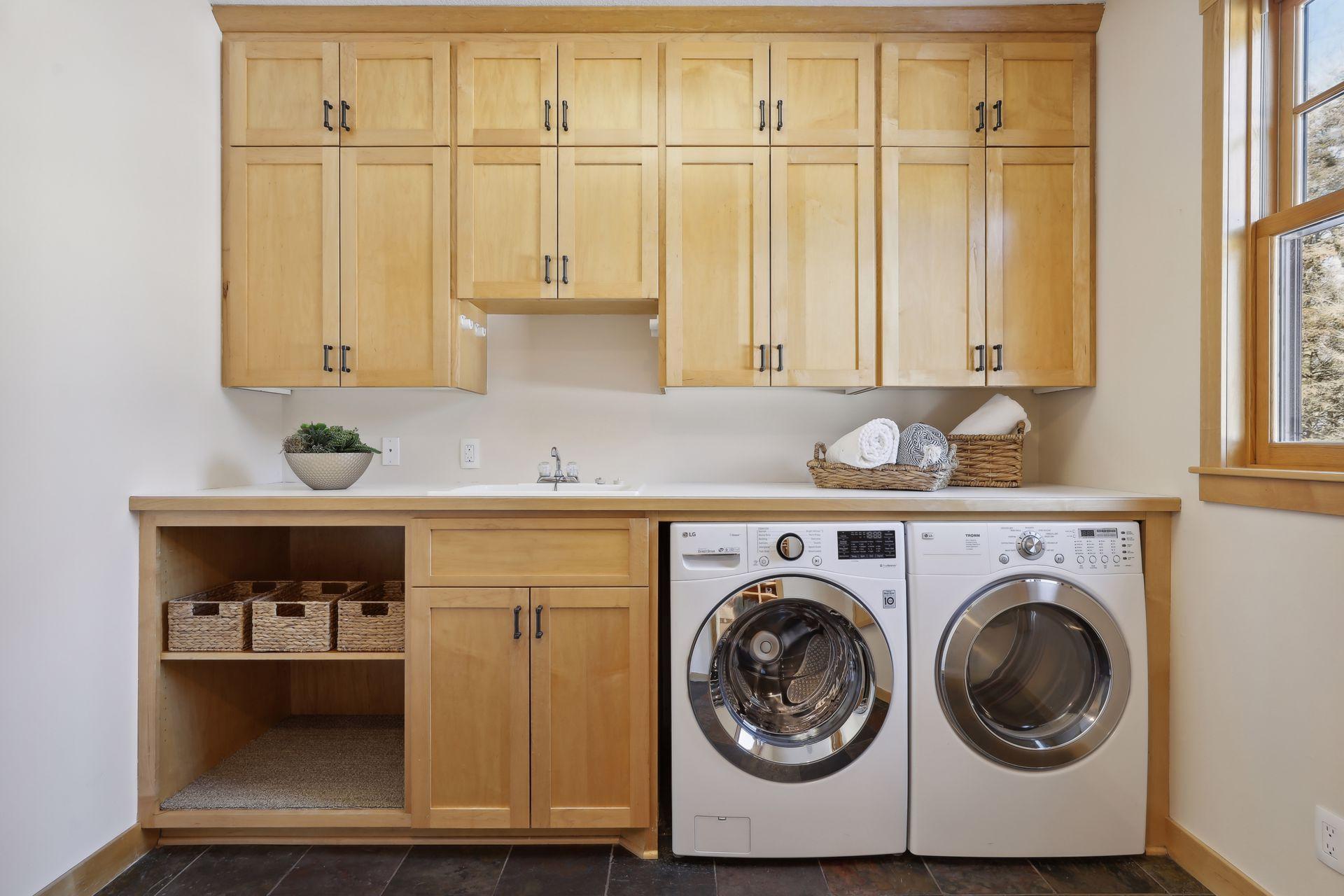 Everything will be neatly organized in this main level laundry room. One of two laundry spaces within the home.