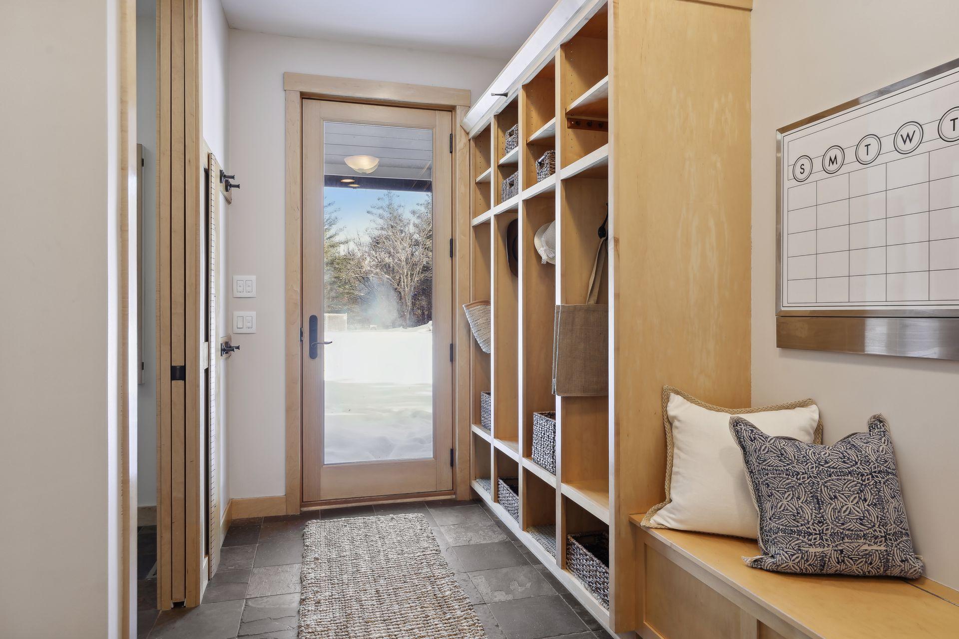 An essential mud room coming off the attached garage with access to the back yard as well.