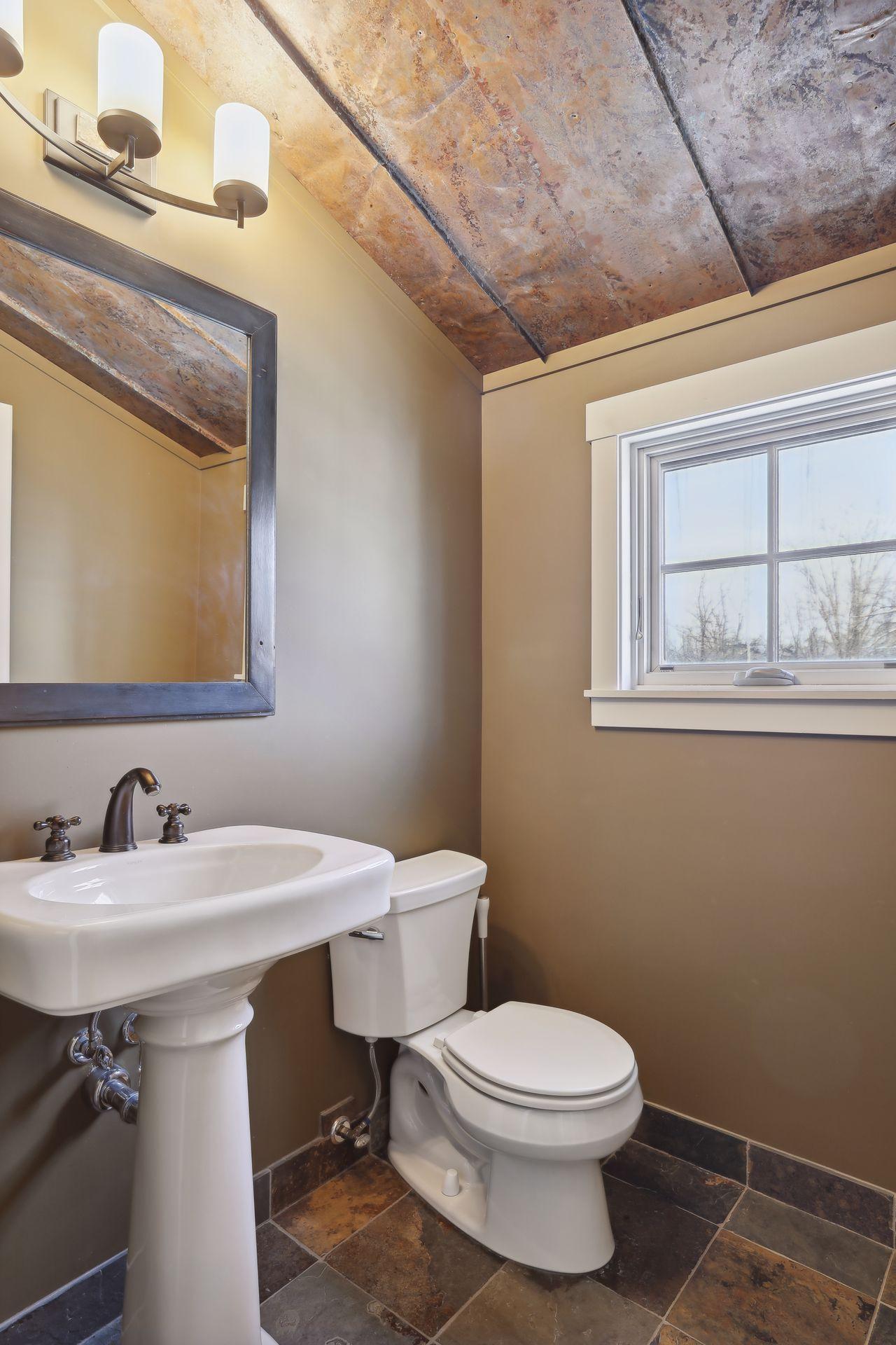 The upper level office/craft room/bonus room bathroom.